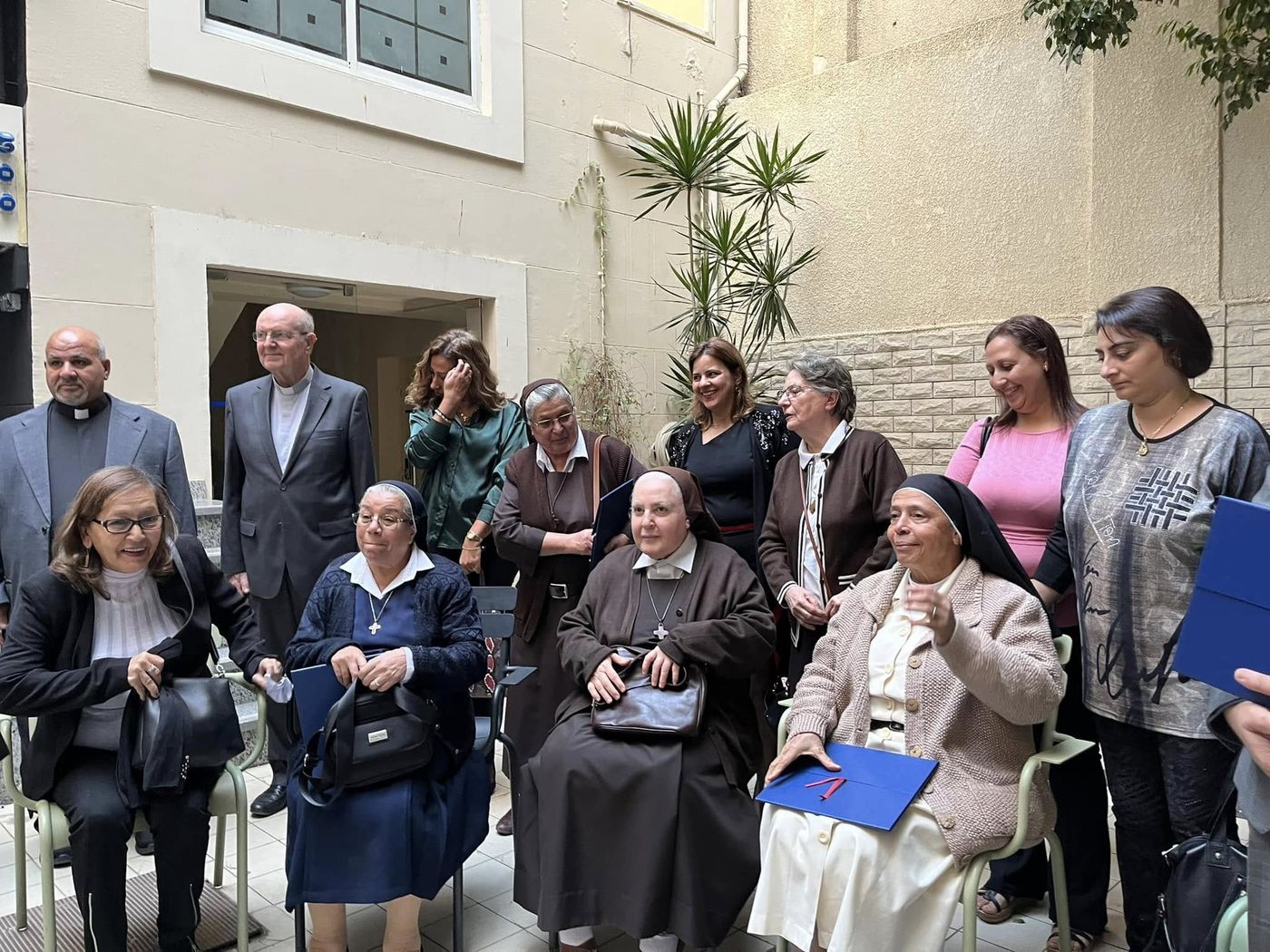 Carmelite sisters and staff receiving the French Quality Label certificates